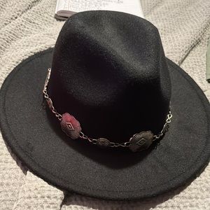 Boutique hat with silver belt around top.